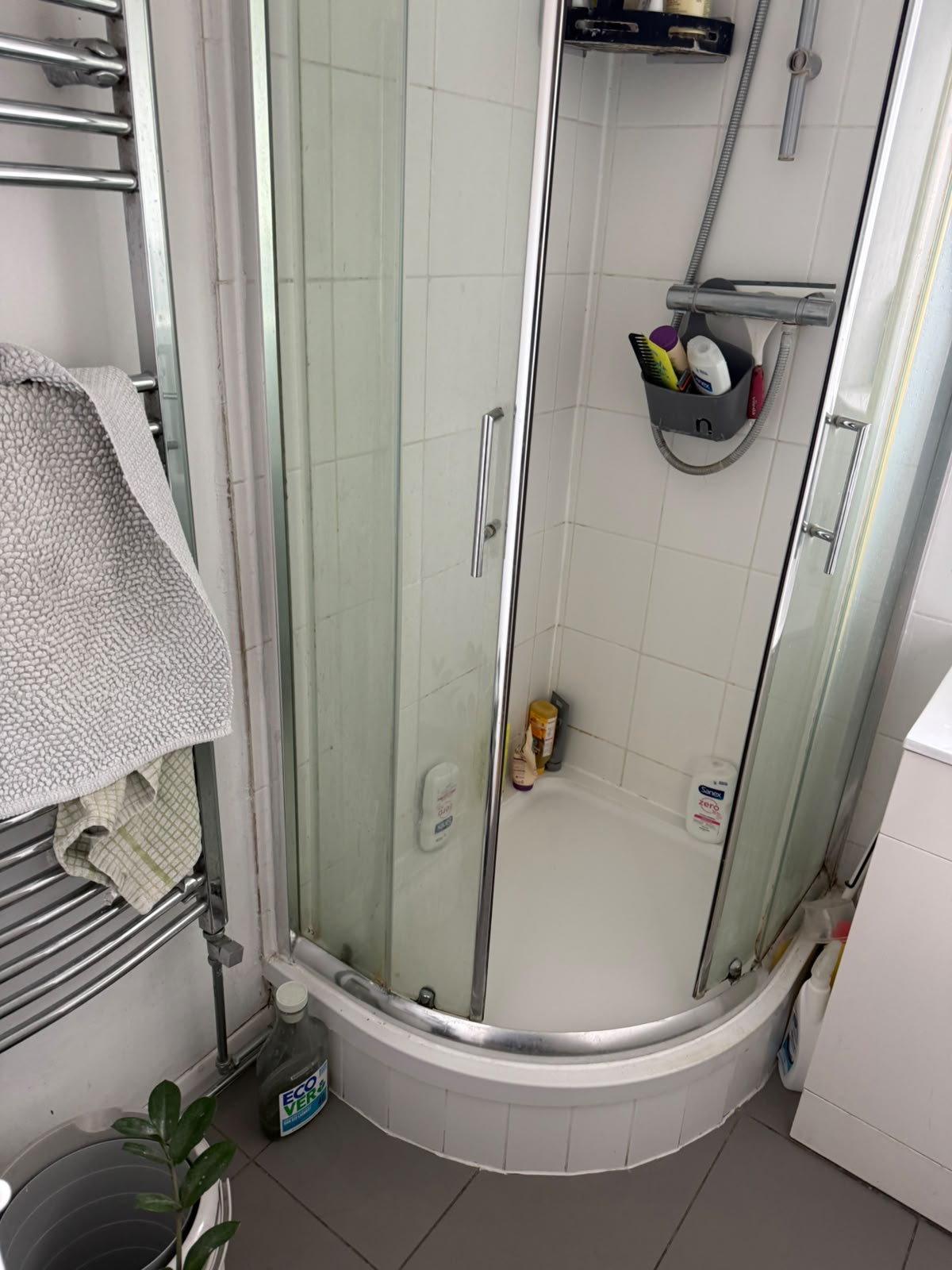 Quadrant shower cubicle and towel radiator after install