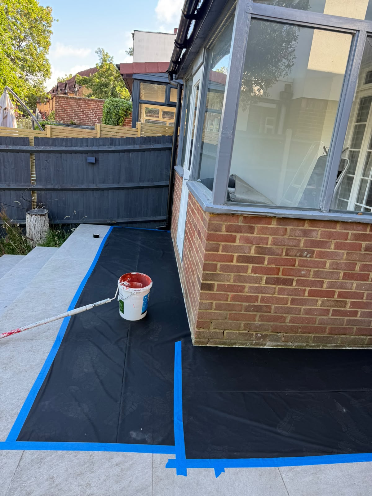 Patio sheeted and taped ready for exterior decorating