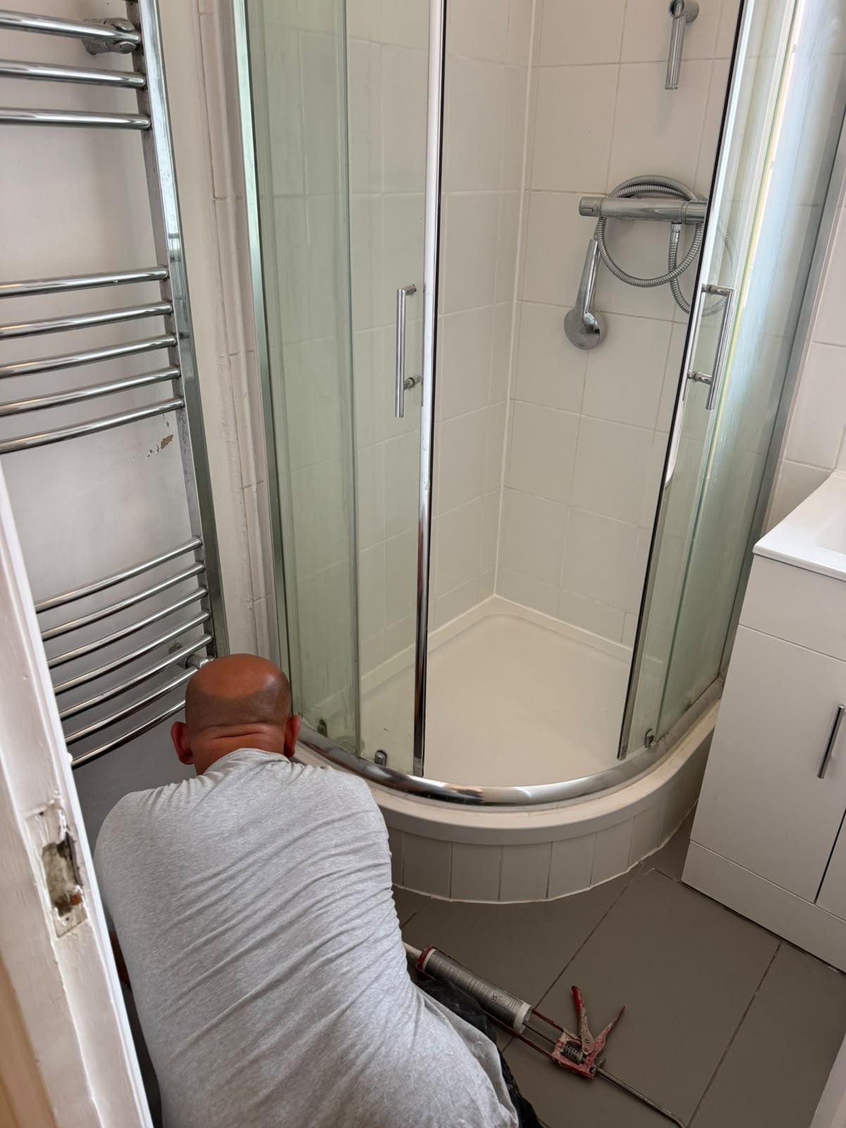Shower tray and enclosure install underway